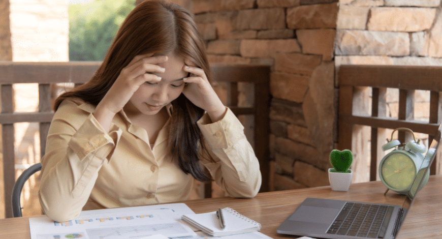 Frustrated shopper at laptop, highlighting common mistakes to avoid when you buy bud online in Canada