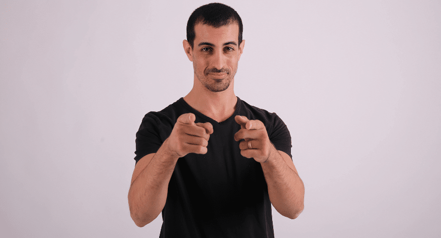 Man confidently pointing at the camera, symbolizing encouragement to buy sativa weed online in Canada